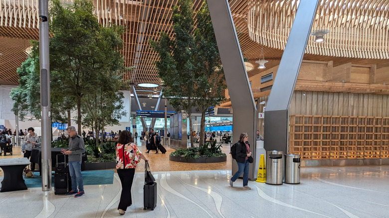 This Trending Pre-Security Airport Glow-Up Could Change Your Next Travel Check-In Experience