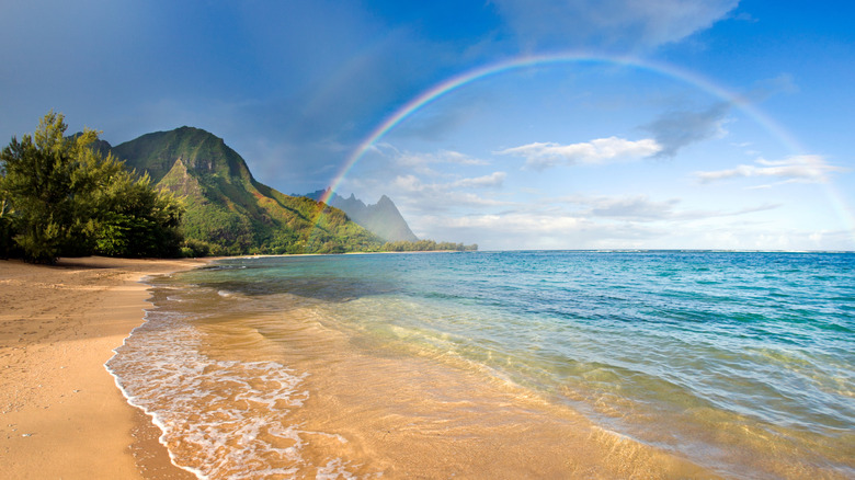 Rainbow over Tunnels Beach on north shore of Kauai, Hawaii