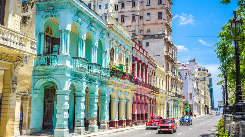 Colorful buildings and vintage cars on downtown Havana street