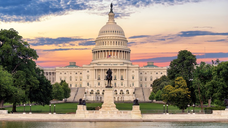United States Capitol Building from across water at sunset