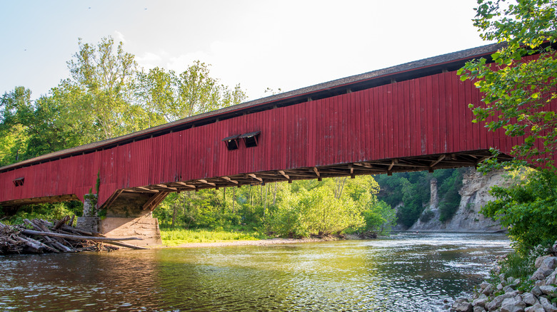 Red covered bridge over Sugar Creek