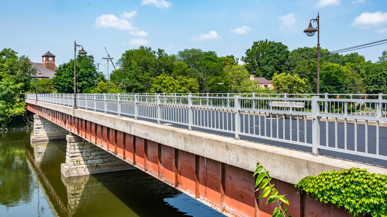 Bridge in Oswego, Illinois, with clock tower in the distance
