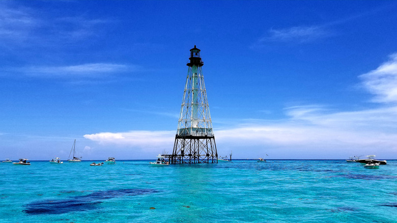 Alligator Reef Lighthouse surrounded by bright blue water in the Florida Keys