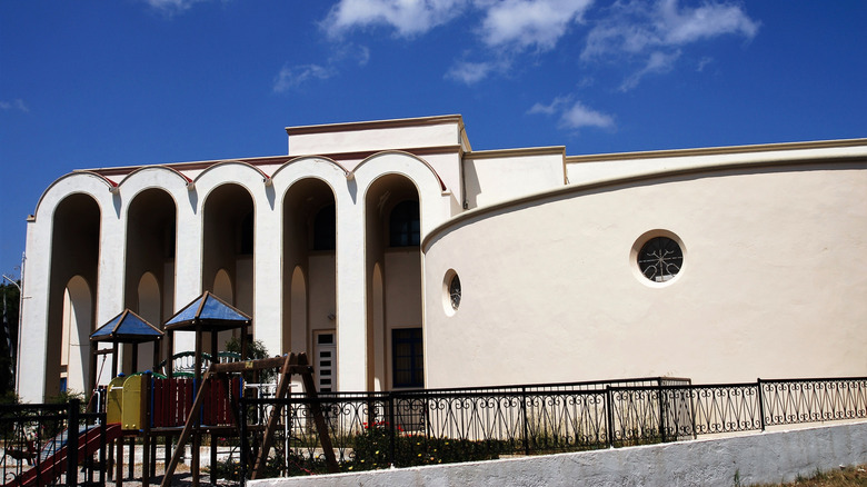 Modernist building with five arched columns
