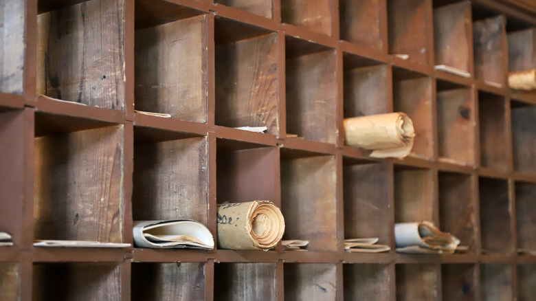 Old scrolls stored in wooden compartments