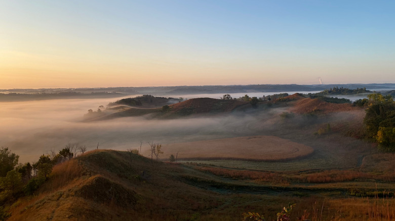 Fog rolling in at sunrise over the Loess Hills in Iowa