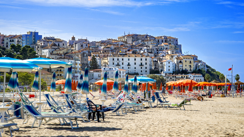 Umbrellas and lounge chairs on the beach of Rodi Garganico, Italy