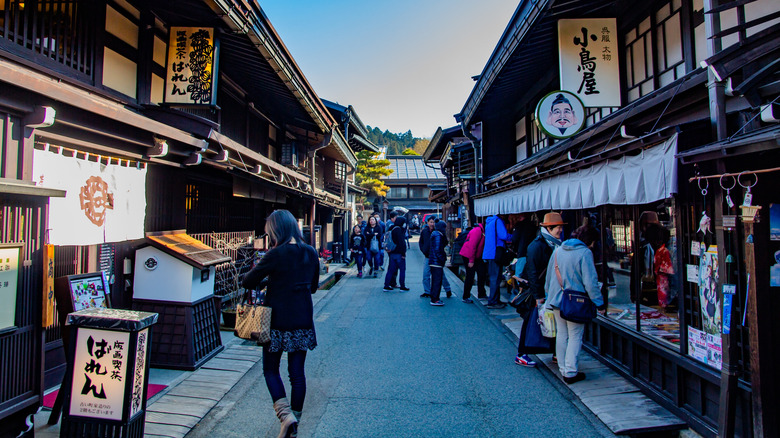 Tourists at Takayama's Sanmachi-Suji district in Japan