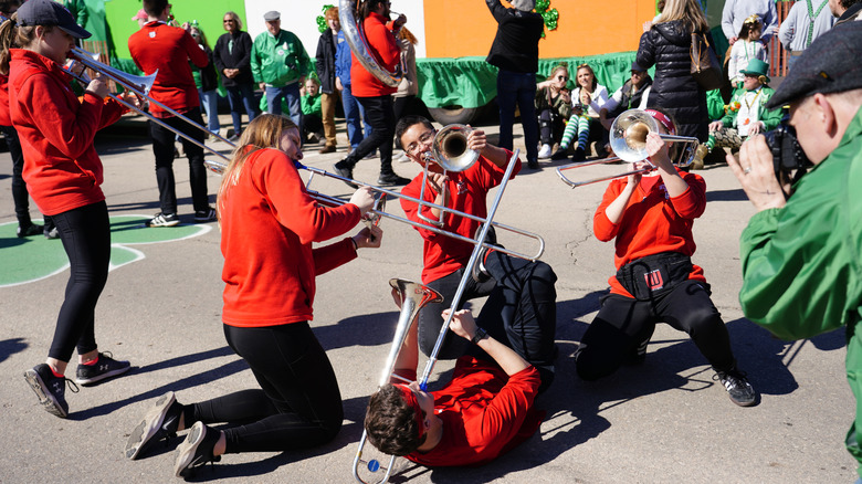 Trombone players performing on St Patrick's parade in New London