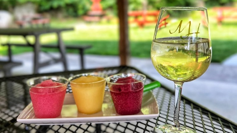 A glass of wine and wine slushies at Mineral Hills Wineryin Massachusetts