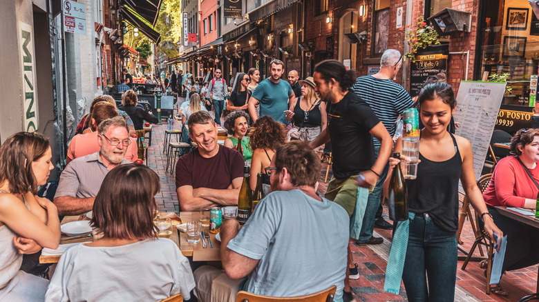 People dining outdoors in Hardware Lane in Melbourne, Australia