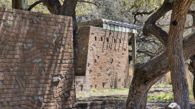 Brick walls and trees amid the Brooks County Safety Rest Area
