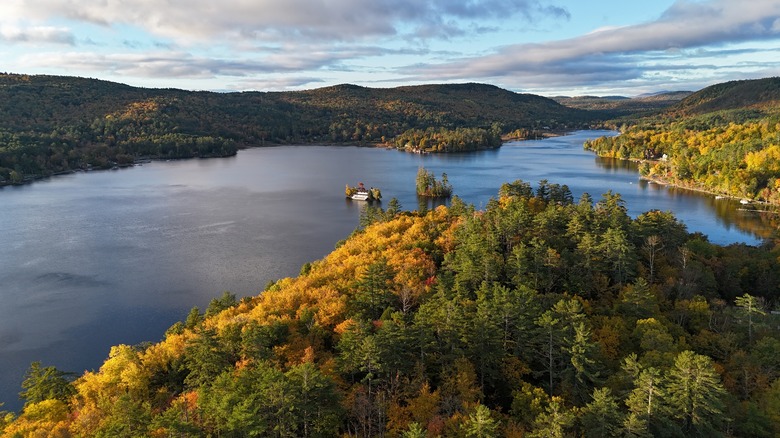 An aerial view of Brant Lake in autumn at sunset