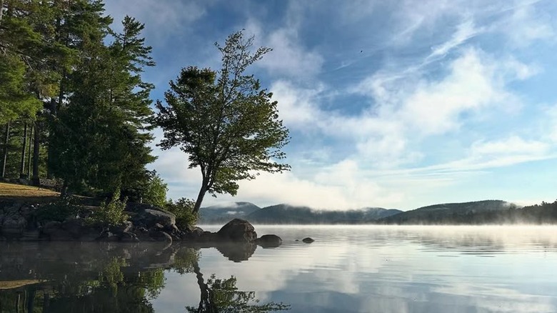 Steam coming off Brant Lake with mountains in the background