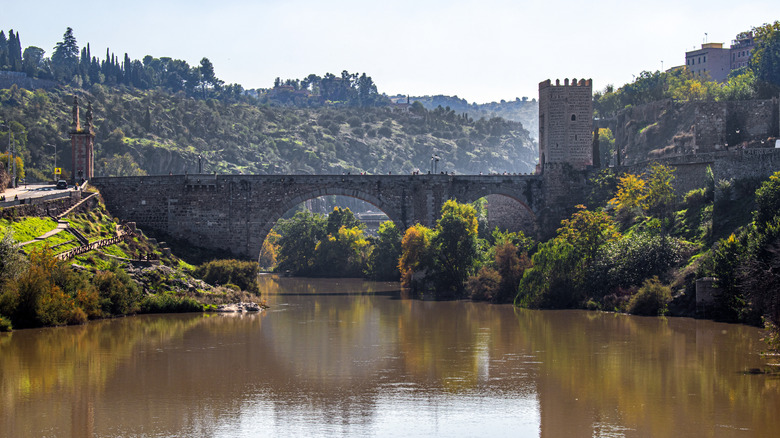 A river carves through the city of Toledo on the edge of La Mancha