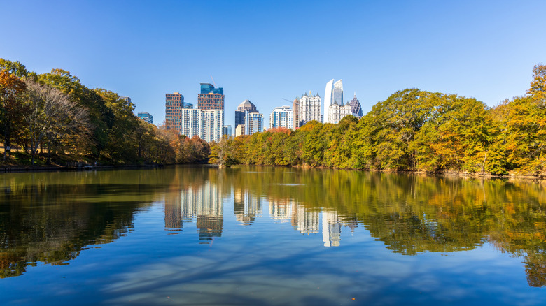 A view of the Atlanta skyline reflected in a pond at Piedmont Park, Atlanta.