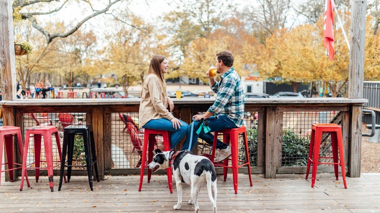 Two people having a beer at Reformation Brewery in Woodstock, Georgia.