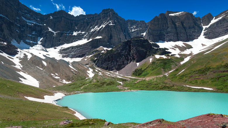 The unique blue waters of Cracker Lake in Glacier National Park, Montana