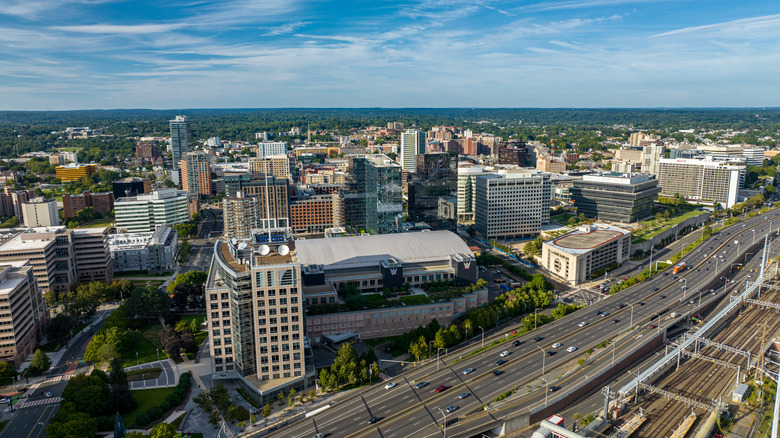 Aerial view of downtown Stamford, Connecticut with business buildings and cars driving during the day.
