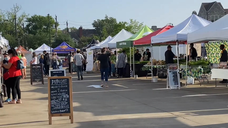 People browsing stalls at the Urban Harvest Farmers Market in Houston.
