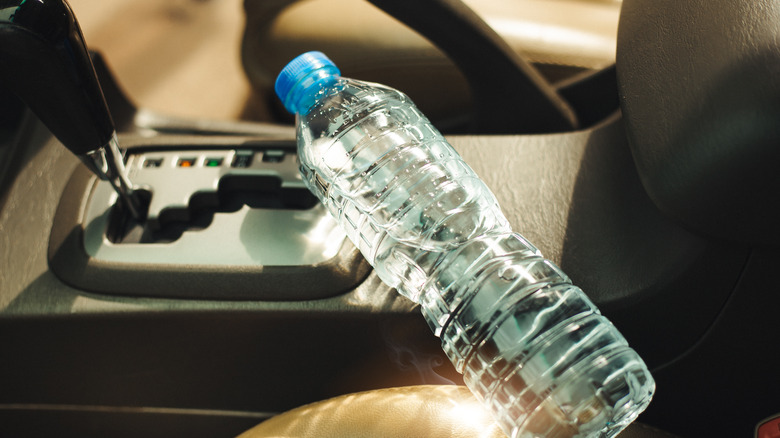 water bottle in the sun in the car