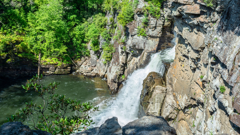 Rocky waterfall flowing into pool