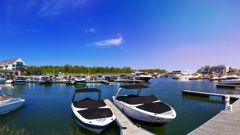 Boats floating at a marina in the Friday Harbour Resort in Innisfil, Ontario