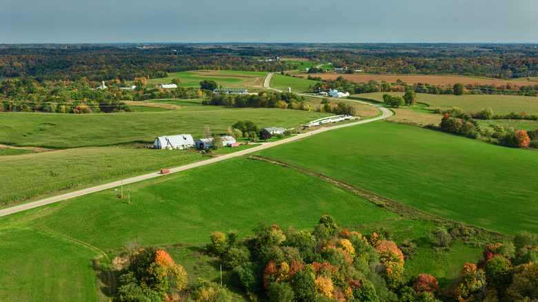 Farmhouses and verdant fields on a fall day in Vernon County