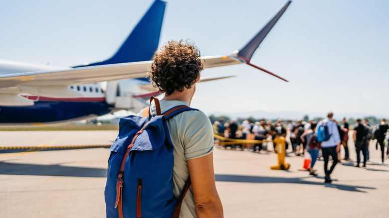Man boarding a plane
