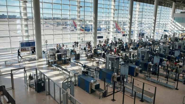 Travelers going through TSA security
