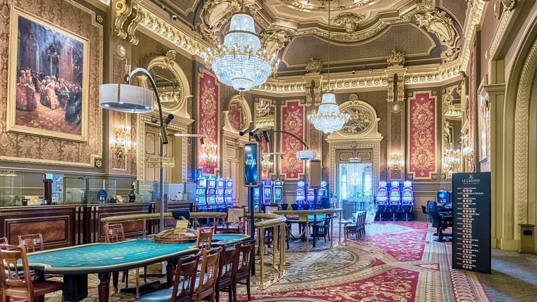 Opulent games room with gold ceilings and crystal chandeliers in the Casino de Monte Carlo