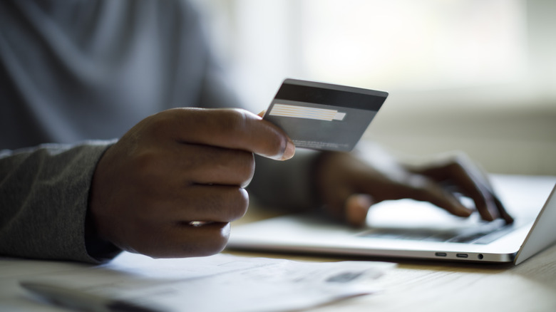 man making credit card payment online