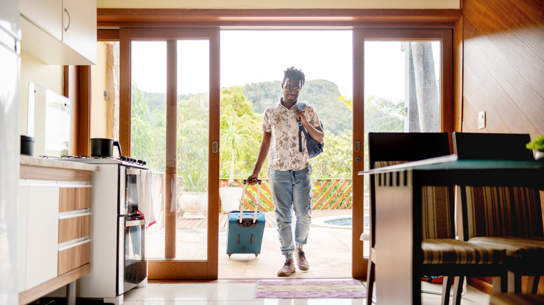 Traveler walking into an Airbnb