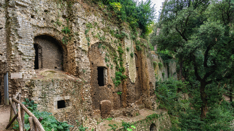 Ruins of an ancient cliffside villa at Villa Gregoriana in Tivoli