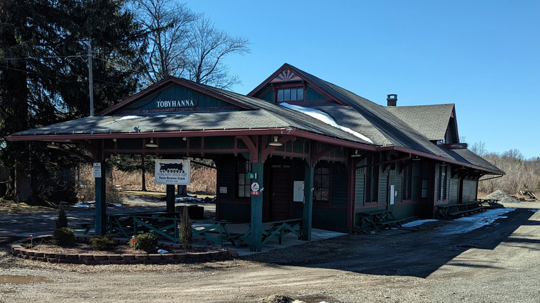 An old-fashioned train station with a sign reading Tobyhanna