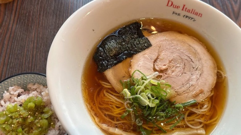 A bowl of Due Italian ramen with accompanying rice bowl