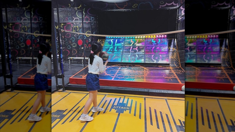 Girl playing virtual basketball at VS Park indoor playground.