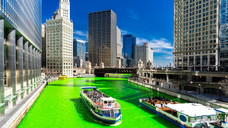 A cruise going down the green Chicago River
