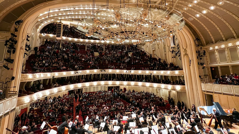 An orchestra performing in the Chicago Symphony Orchestra Hall