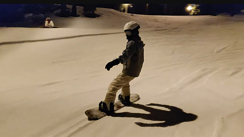 A young boarder at night on Snow Summit.