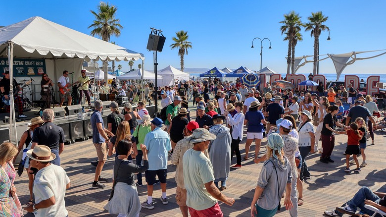 Dancing to live music at the stage for Clam Fest in Pismo Beach