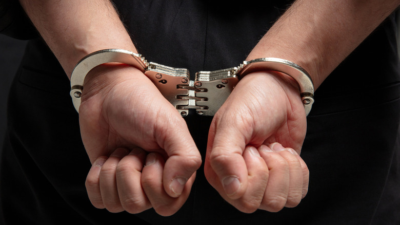 hands in handcuffs closeup view