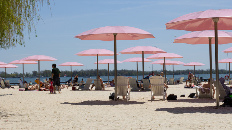 Pink umbrellas at Sugar Beach in Toronto facing Lake Ontario