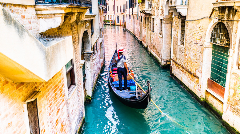 A lone gondola floating along Venice streets