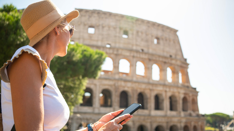 Woman using phone at Coliseum