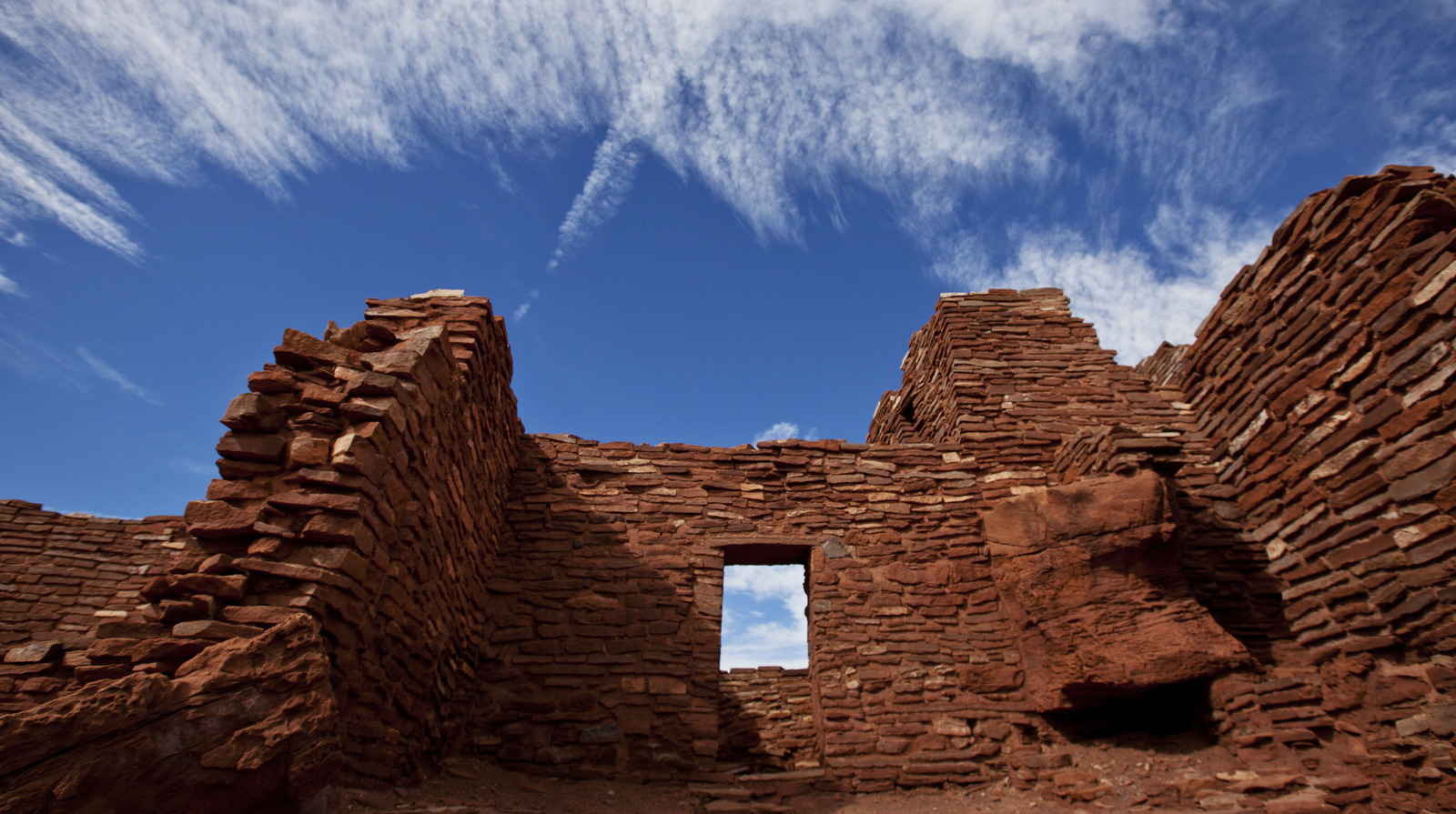 Towering Red Rock Ruins And Vast Desert Views Unveil An
