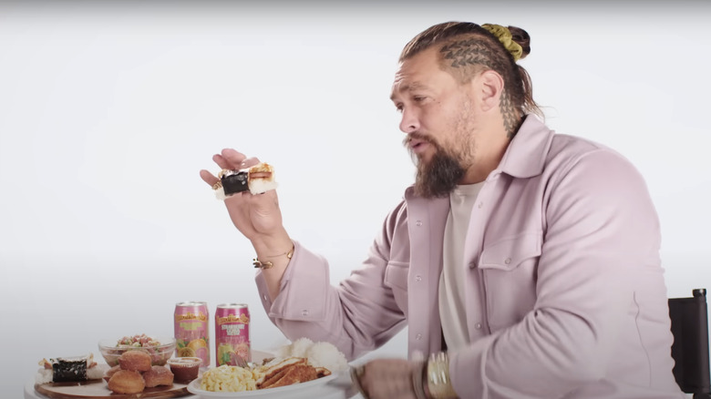 Jason Momoa holding Spam musubi