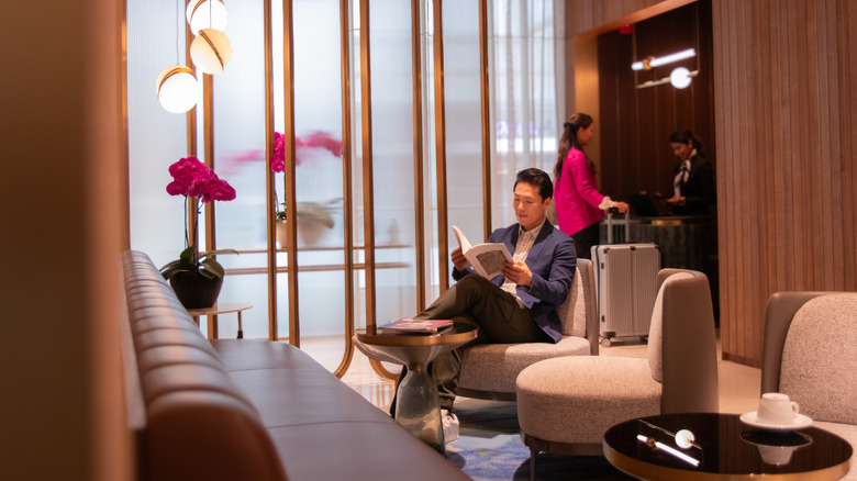 Man sitting inside an airport VIP lounge