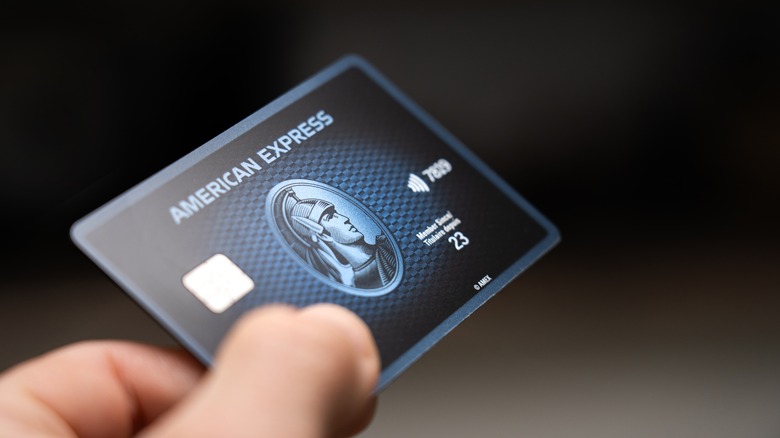 Person holding an American Express card