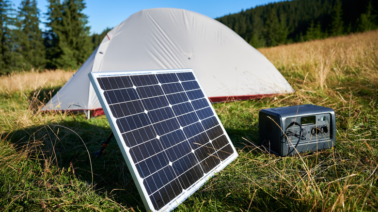 solar panel with power station in front of a tent